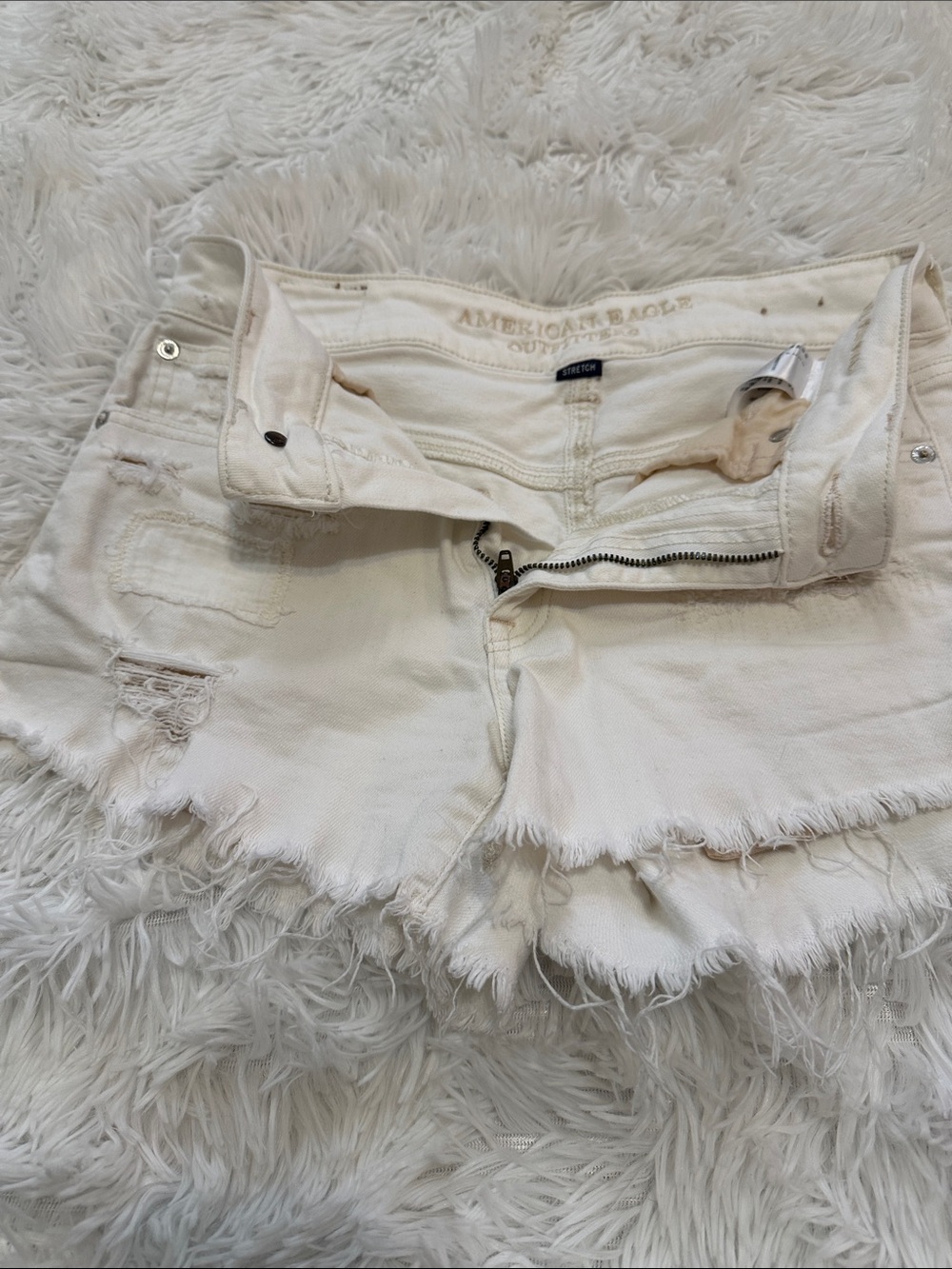 American Eagle Outfitters Cream Frayed Denim Cutoff Shorts
